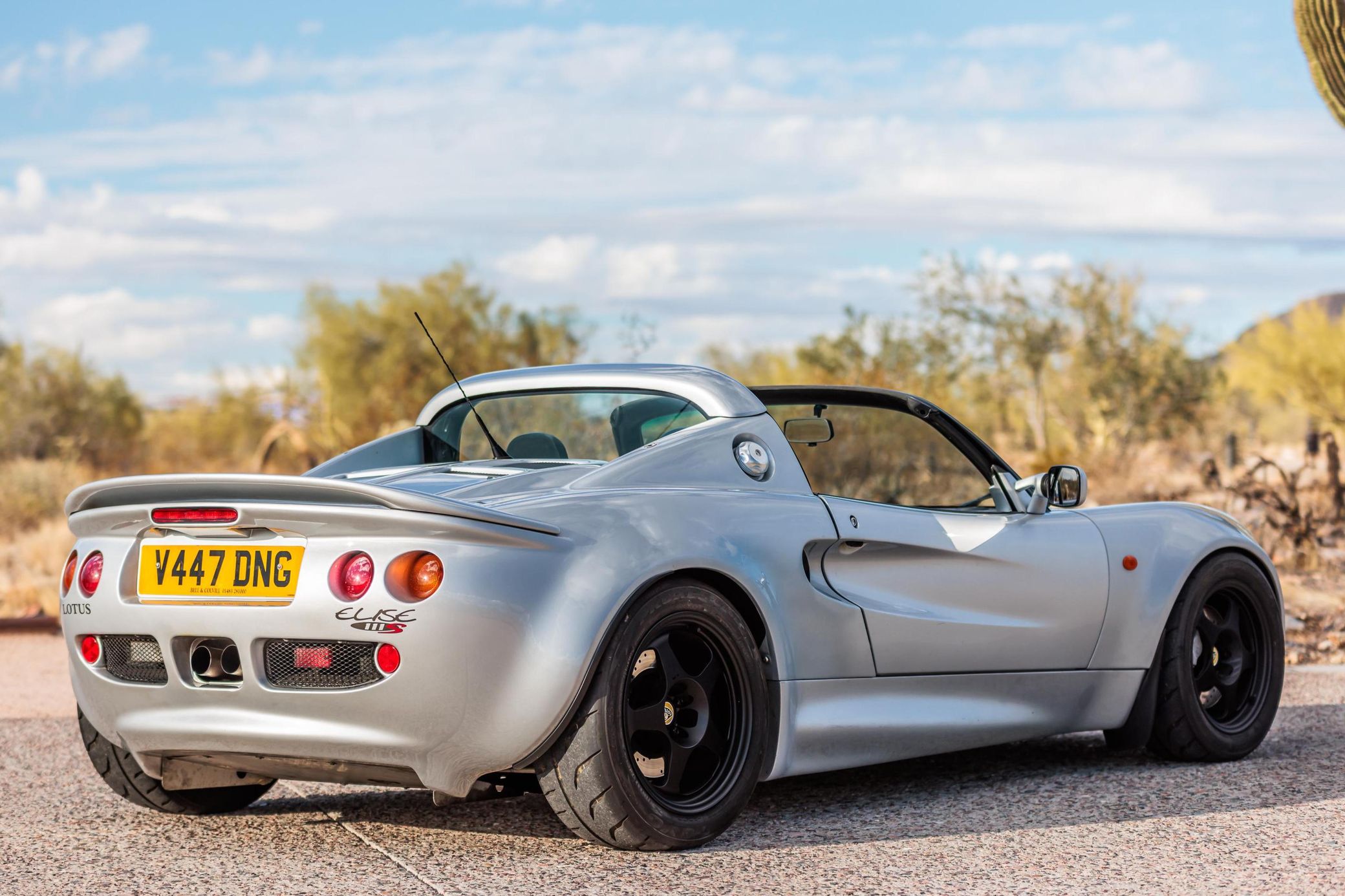 3/4 rear view of a 1999 silver Lotus Elise 111 S