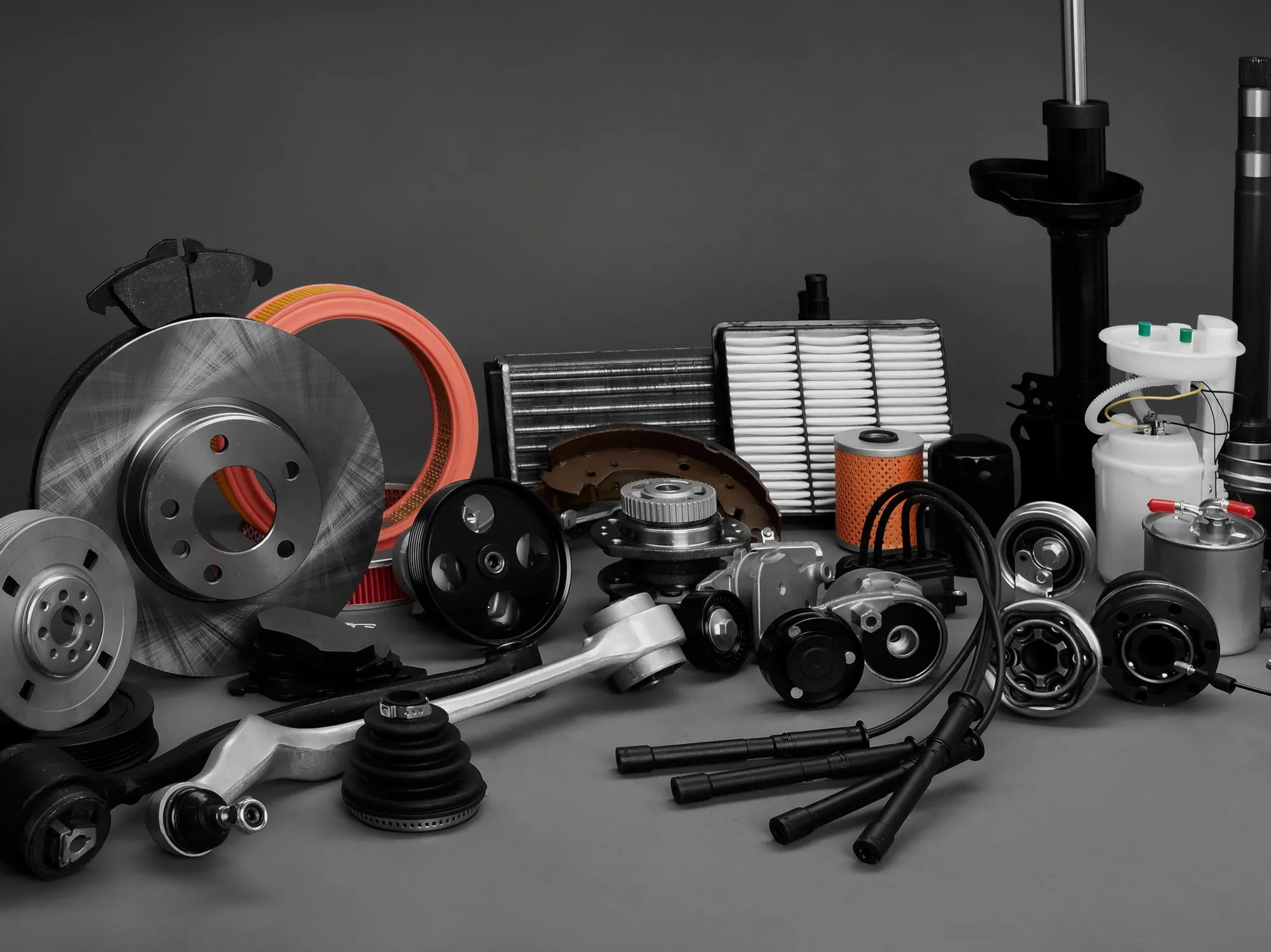 Various car parts displayed with a gray background