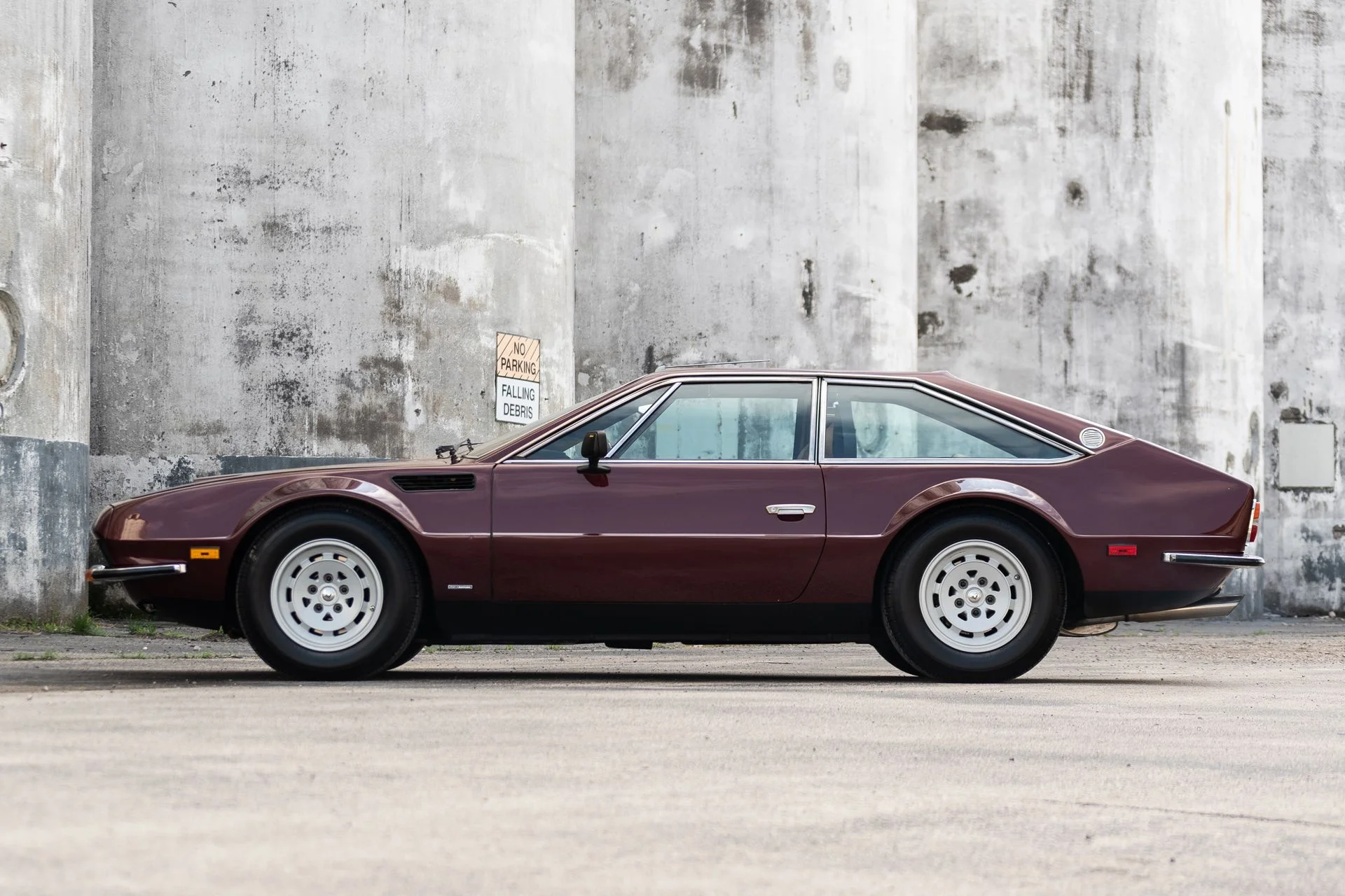 side view of a 1974 burgundy Lamborghini Jarama S