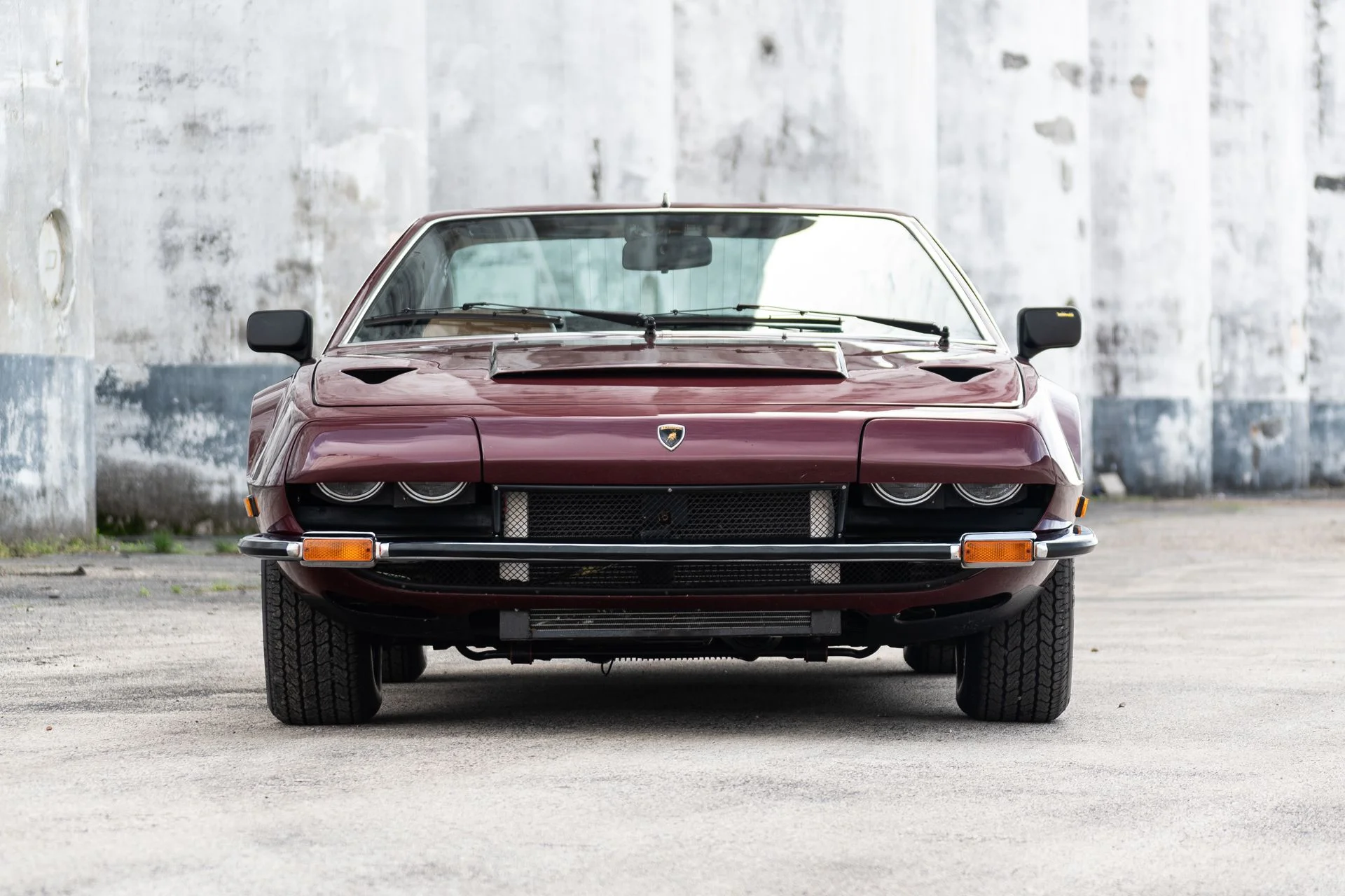 front view of a 1974 burgundy Lamborghini Jarama S