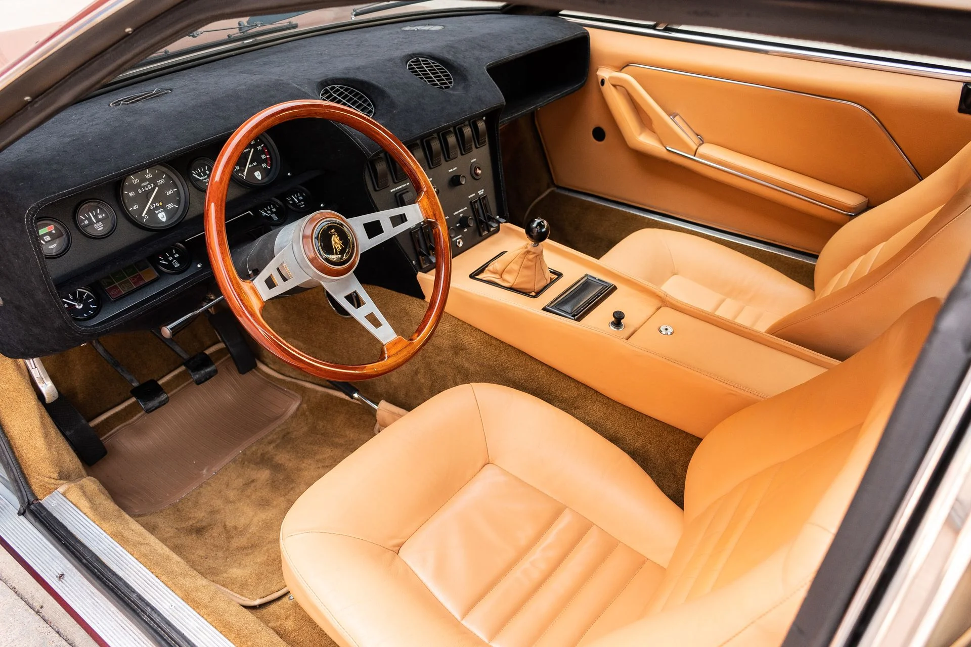 interior of a 1974 burgundy Lamborghini Jarama S