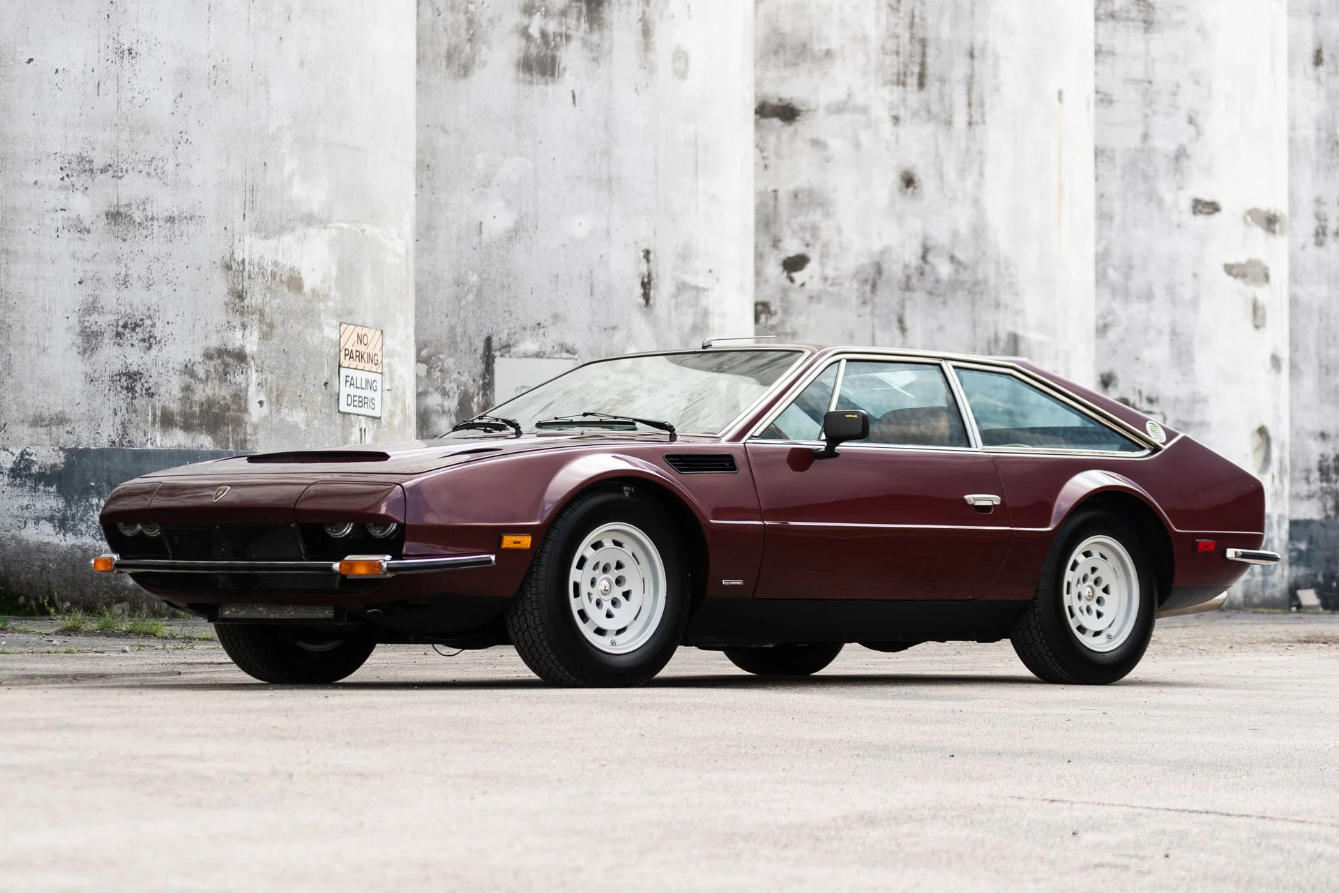 3/4 front view of a 1974 burgundy Lamborghini Jarama S