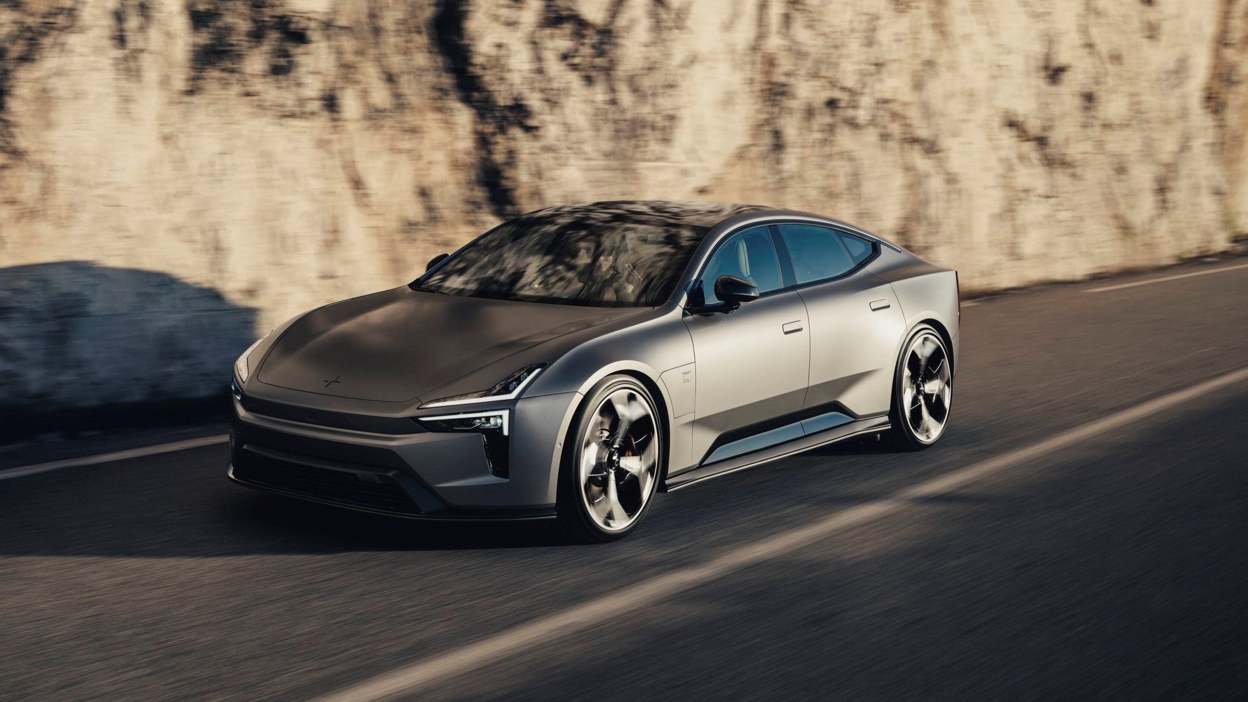 Three-quarter front view of a 2026 gray Polestar 5 sports sedan