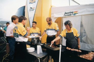Di and Stuart Spires at work cooking up lunch for the team during their days with Benetton. Photo: Spires Collection