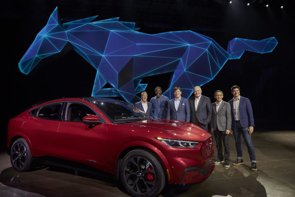 From left, Ford Motor Company Executive Chairman Bill Ford, actor Idris Elba, Ford President of New Businesses, Technology and Strategy Jim Farley, Ford Motor Co. President and CEO Jim Hackett, Ford Chief Product Development Officer Hau-Thai Tang and Ford Enterprise Product Line Director for Global Electrification Ted Cannis at the reveal of the all-electric Ford Mustang Mach-E SUV at Jet Center Los Angeles in Hawthorne, California on Sunday, Nov. 17, 2019.