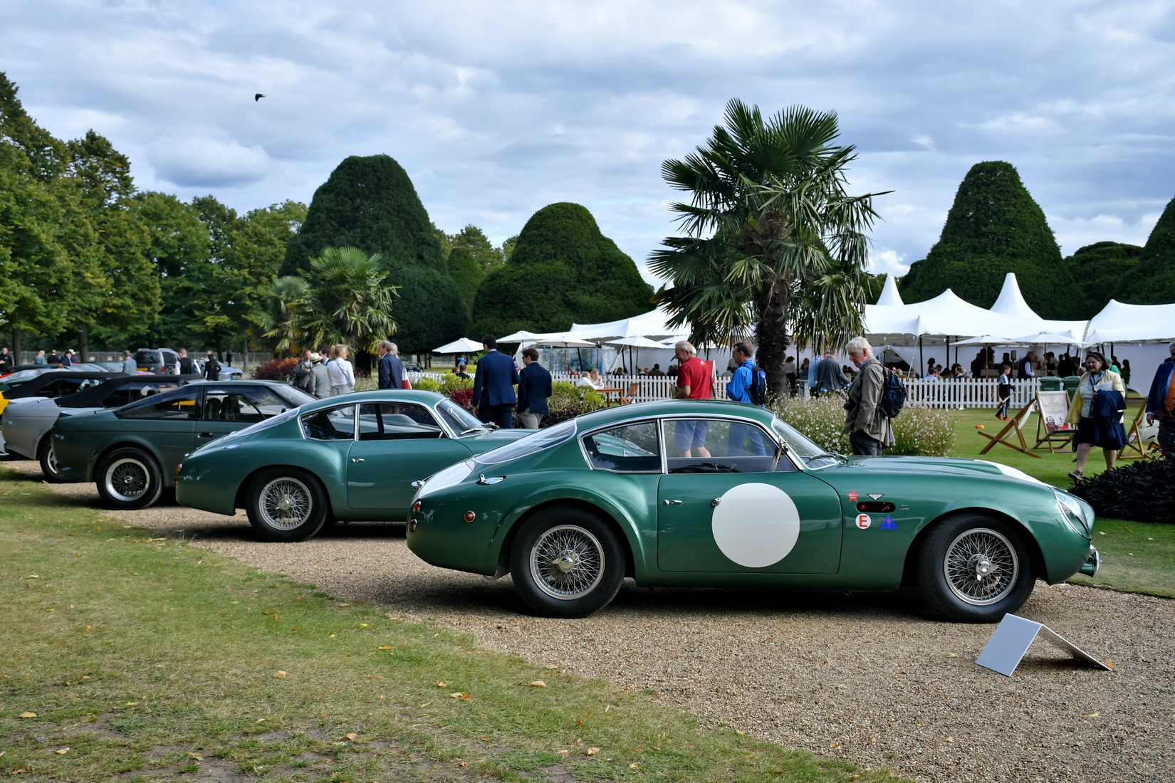 Two green Aston Martin DB4 GT Zagato from 1961 standing side by side