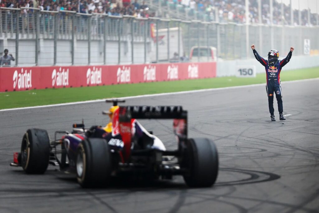 Vettel celebrates with Ricciardo driving at the 2011 Australian Grand Prix