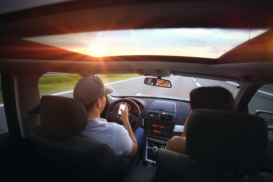 Man on phone while driving