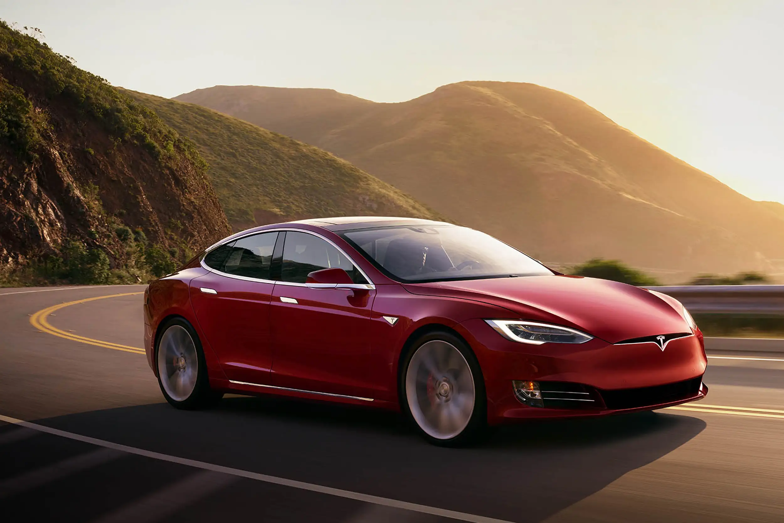 A side view of a Tesla Model S Plaid being tried out on the track