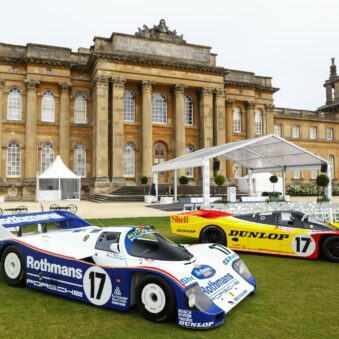 Historic Porsche Endurance Racers stand in front of Blenheim Palace