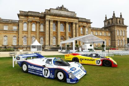 Historic Porsche Endurance Racers stand in front of Blenheim Palace