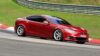 A side view of a Tesla Model S Plaid being tried out on the track