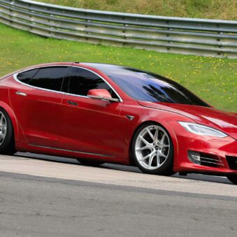 A side view of a Tesla Model S Plaid being tried out on the track
