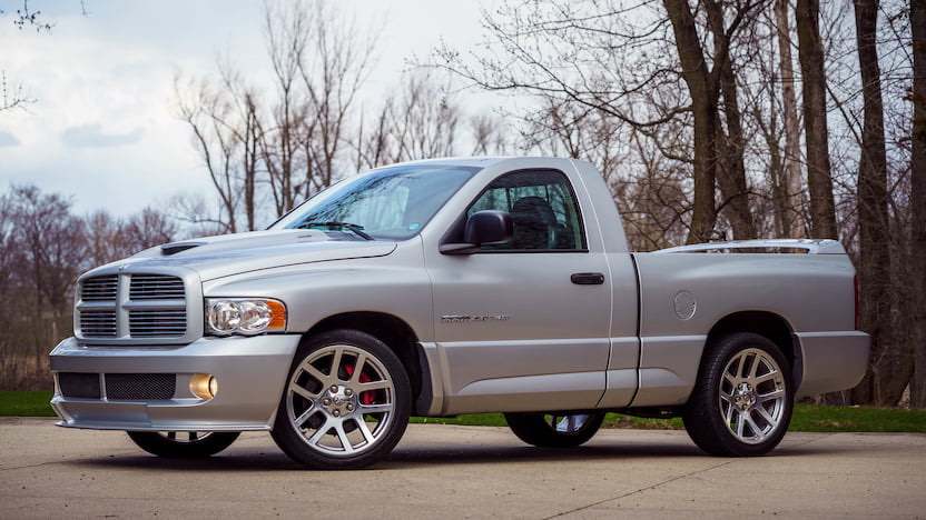Silver 2006 Dodge RAM SRT-10 parked in front of trees