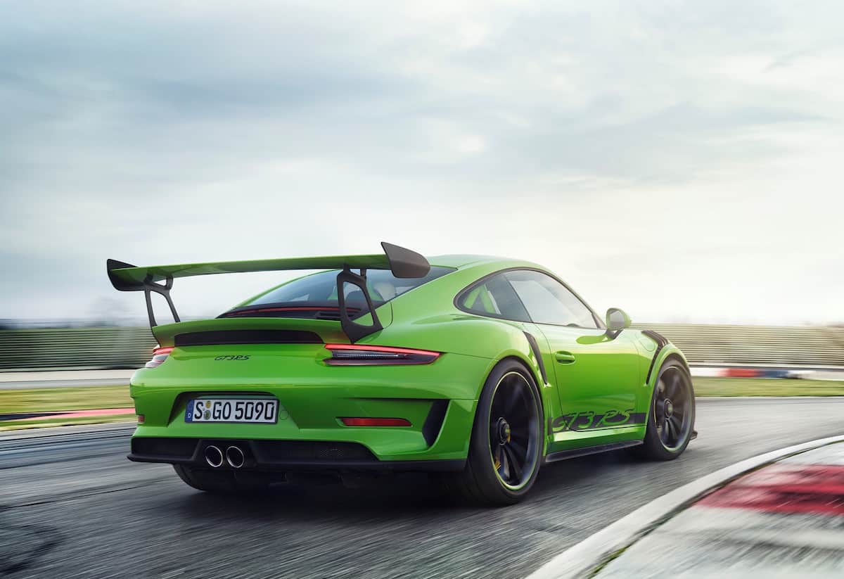 Green 2019 Porsche GT3 RS being driven on track