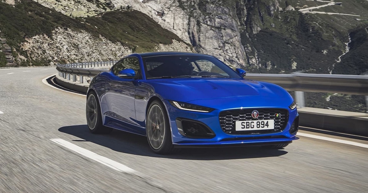 2022 blue Jaguar F-Type R on a curvy road
