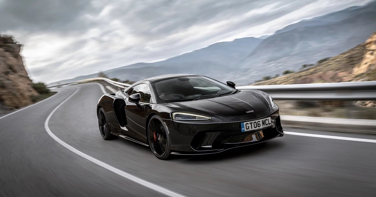 2022 black McLaren GT on a curvy road