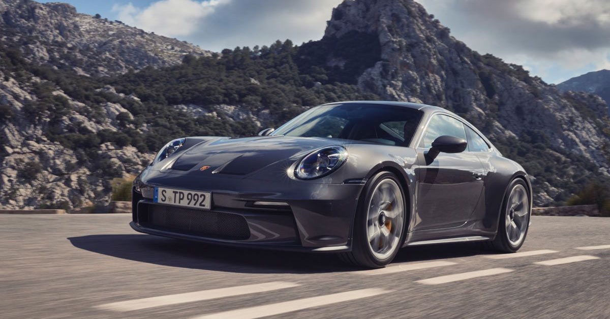 2022 grey Porsche 911 GT3 Touring on a rocky mountain road