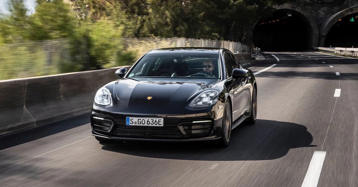 2022 black Porsche Panamera coming out of a tunnel