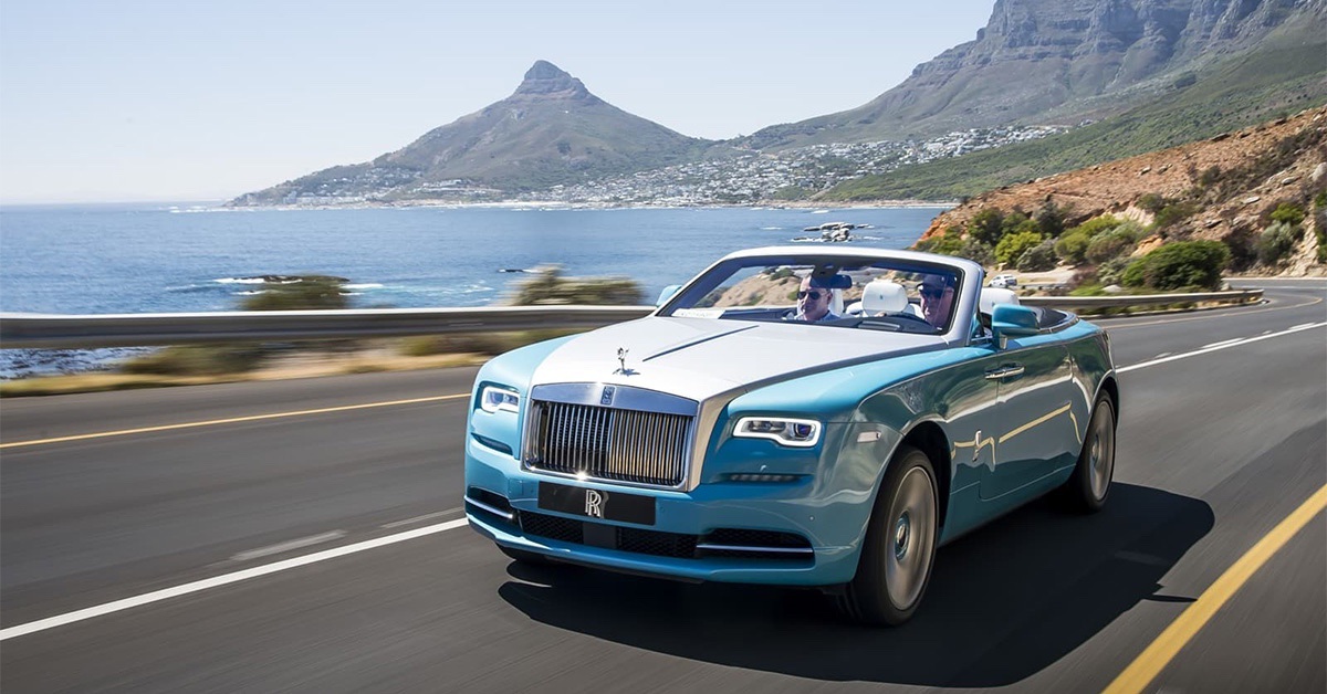 2022 blue Rolls Royce Dawn with ocean background