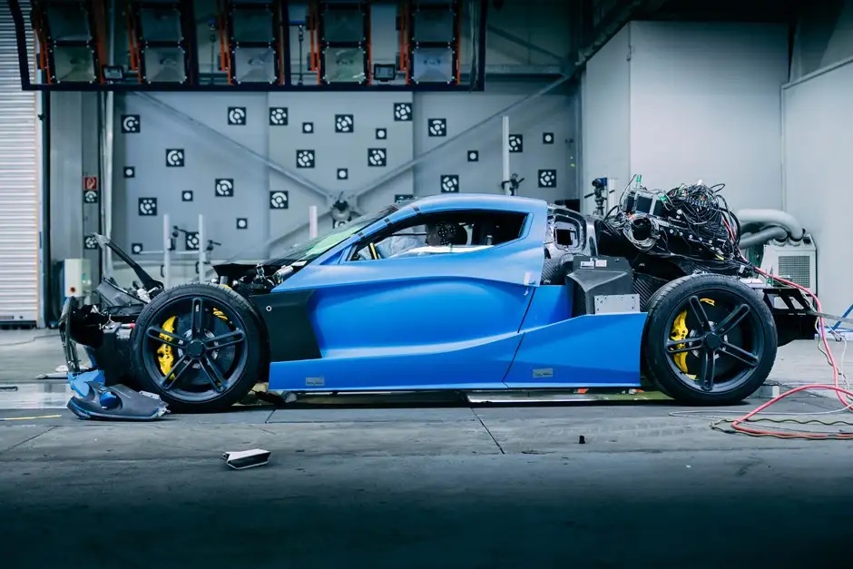 Blue Rimac Nevara after repeated front and rear crashes with safety cell intact