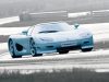 Blue Koenigsegg CC8S driving on snowy road in winter