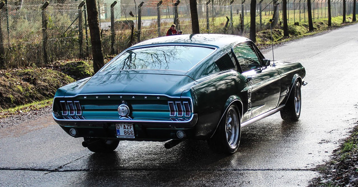 1967 Ford Mustang Fastback leaving a car show in Europe