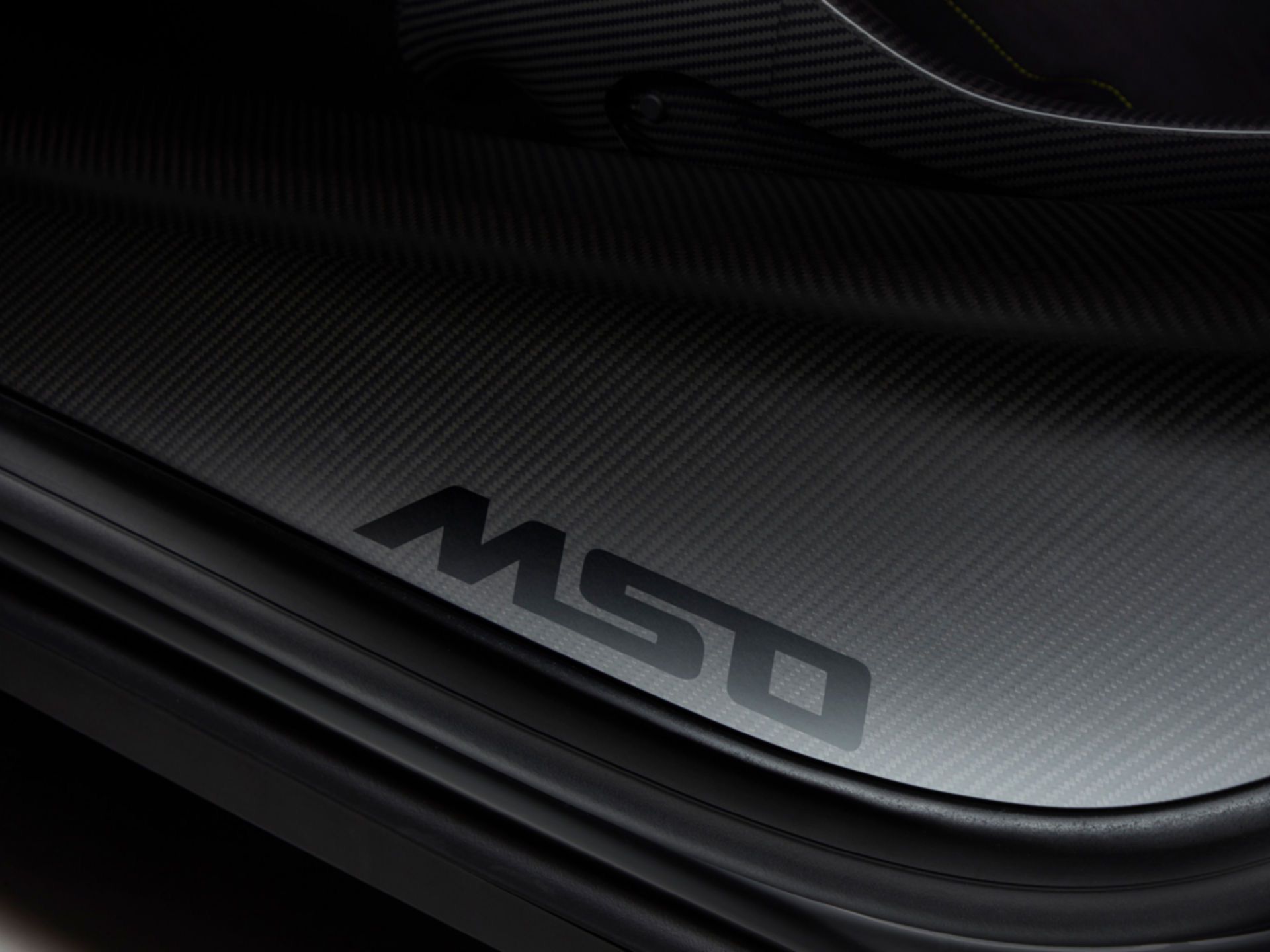 The McLaren Special Operations logo on the door sill of a 720S.
