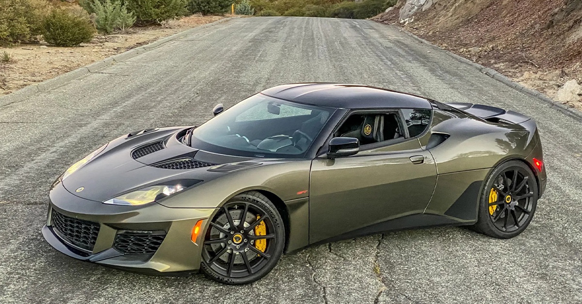 Green Lotus Evora GT in the middle of the road