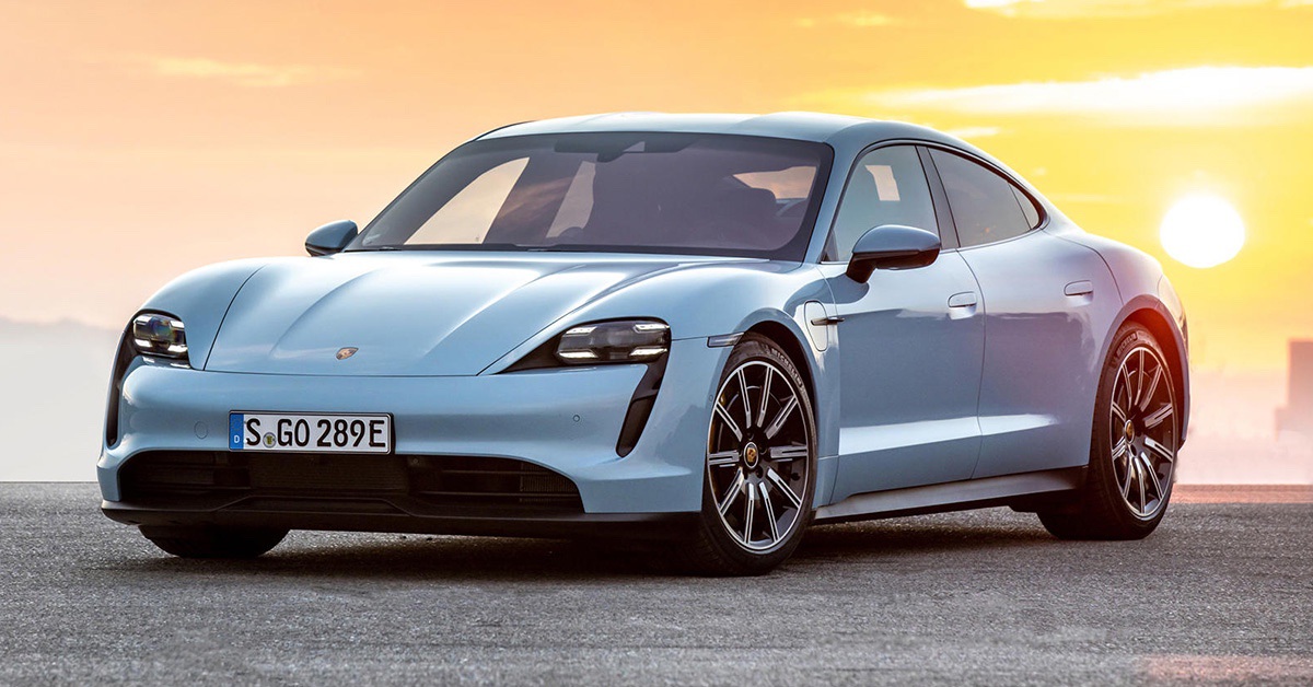 Blue Porsche Taycan with sunset background