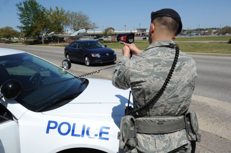 Police officer using a laser gun