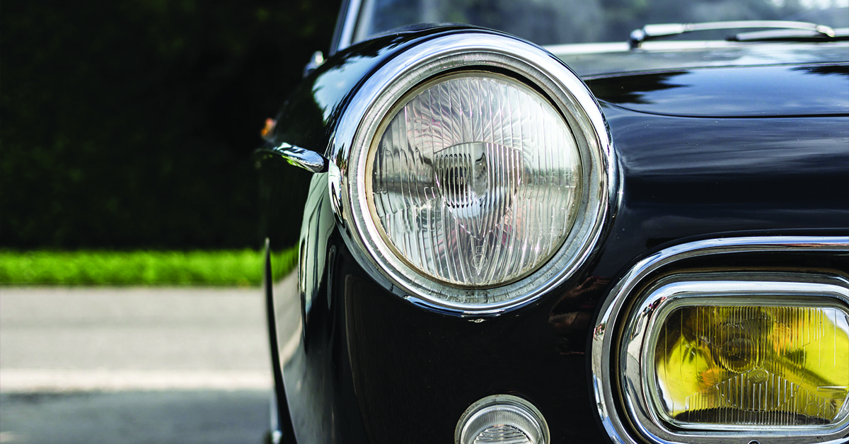 Vintage car up close with yellow fog lights
