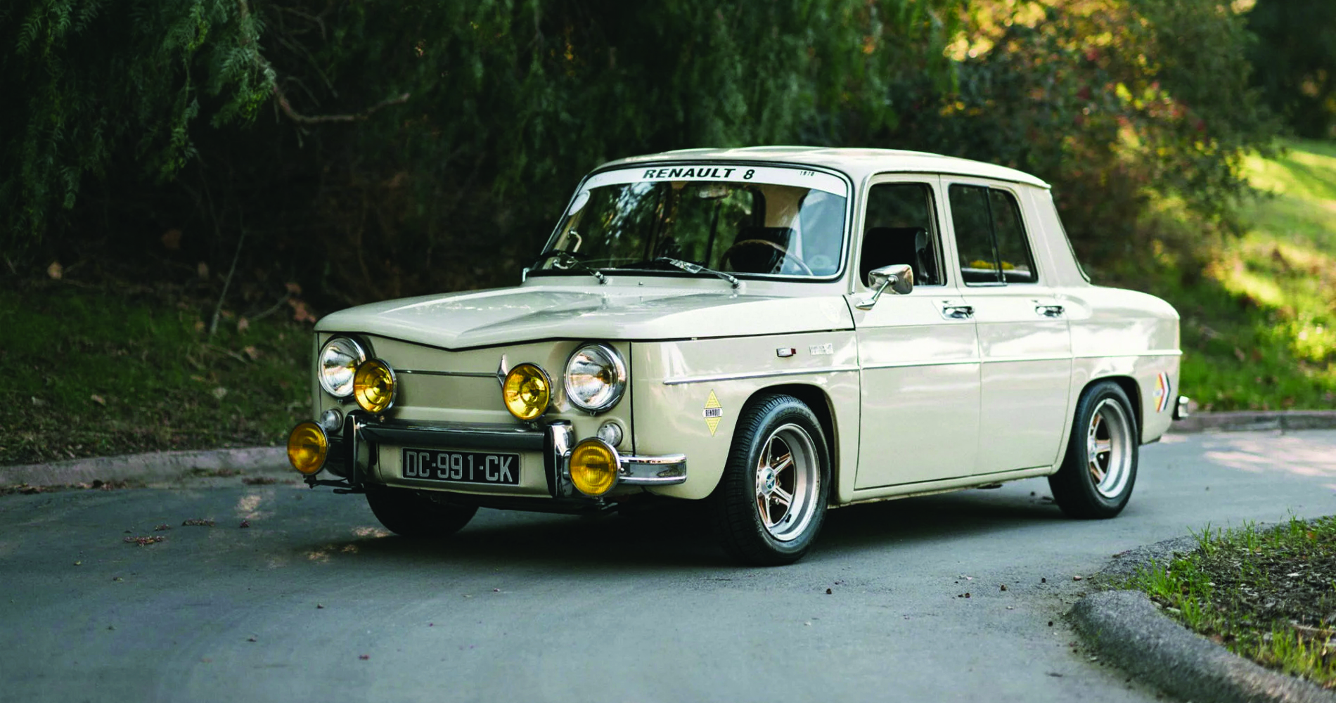 Renault 8 as vintage rally car with yellow fog lights