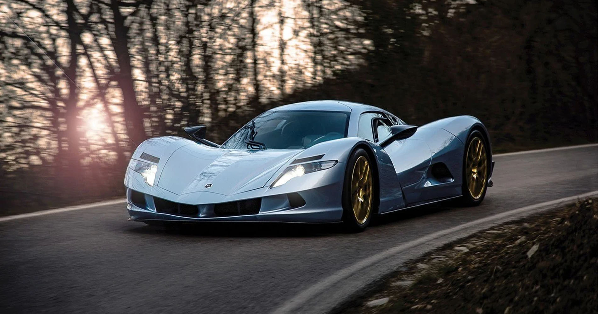 Silver Aspark Owl fully electric hypercar on a curvy road