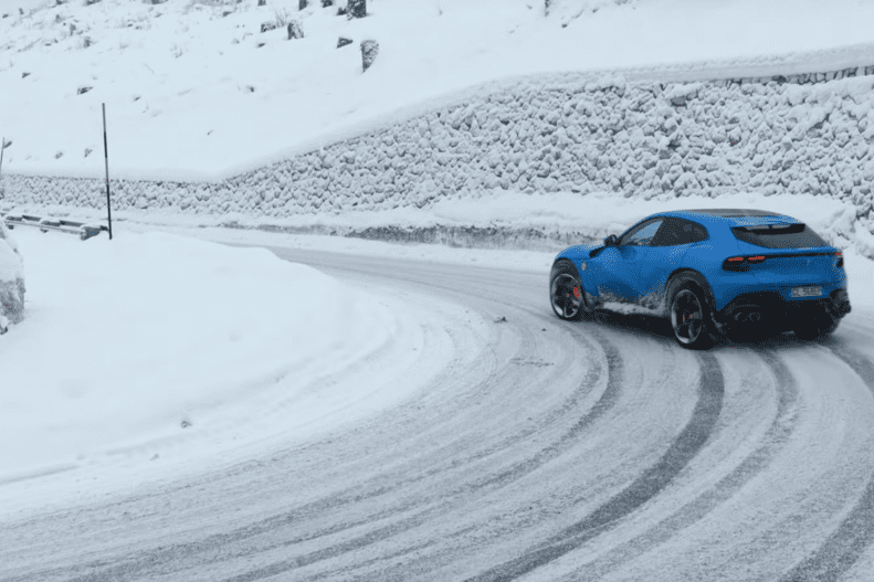 Ferrari Purosangue drifting in the Italian snow