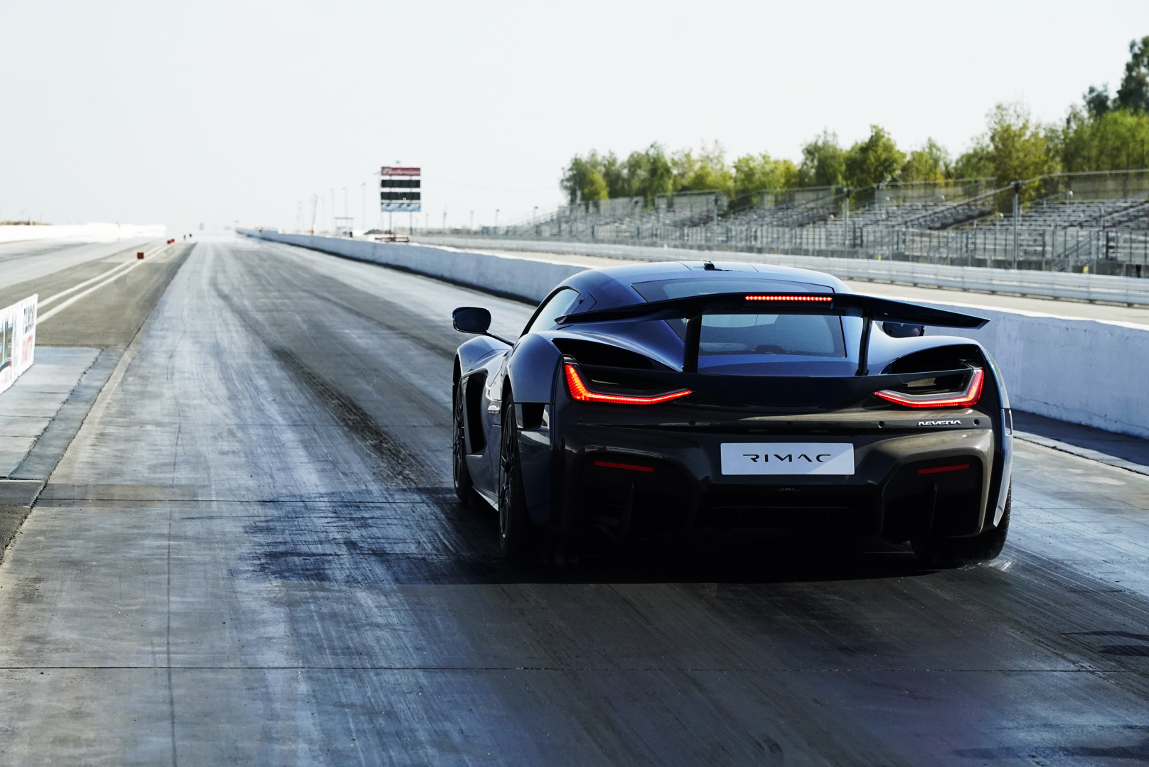 Image showing the rear profile of a Rimac Nevera at the drag strip