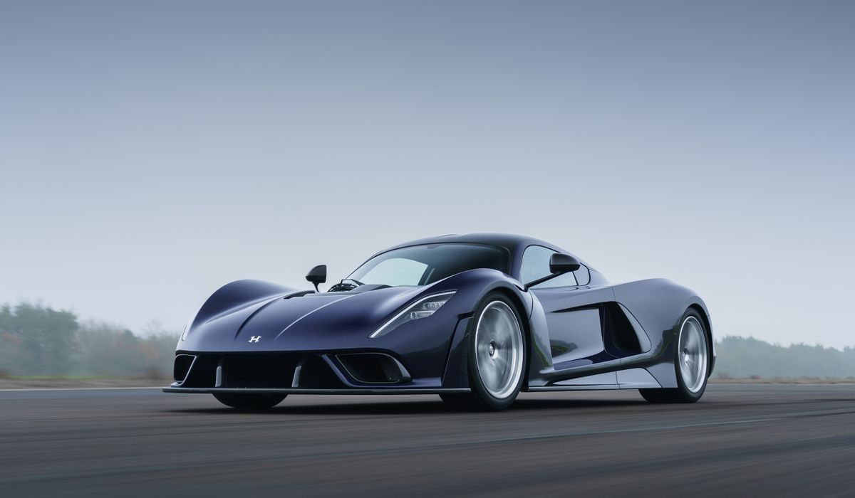 Image showing the front angled profile of a dark blue Hennessey Venom F5 hypercar