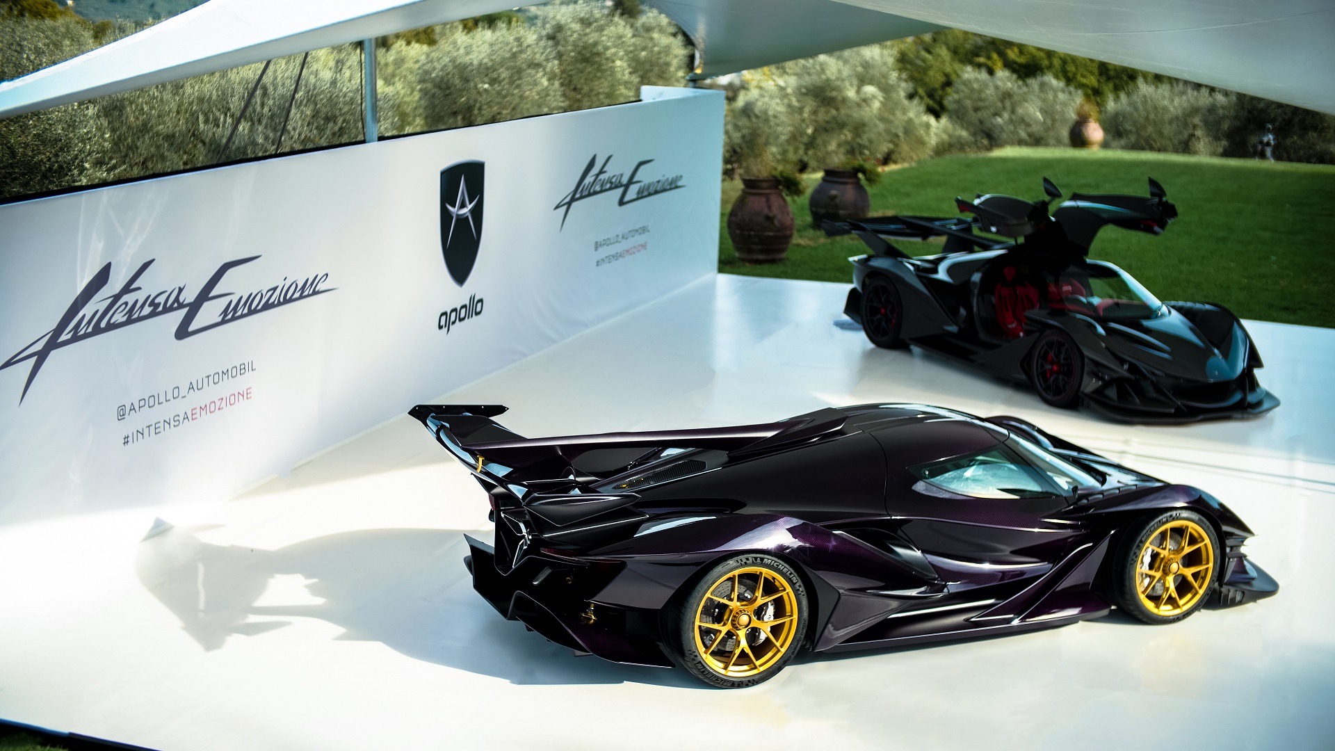 Image showing two Apollo Intensa Emozione hypercars at a car event