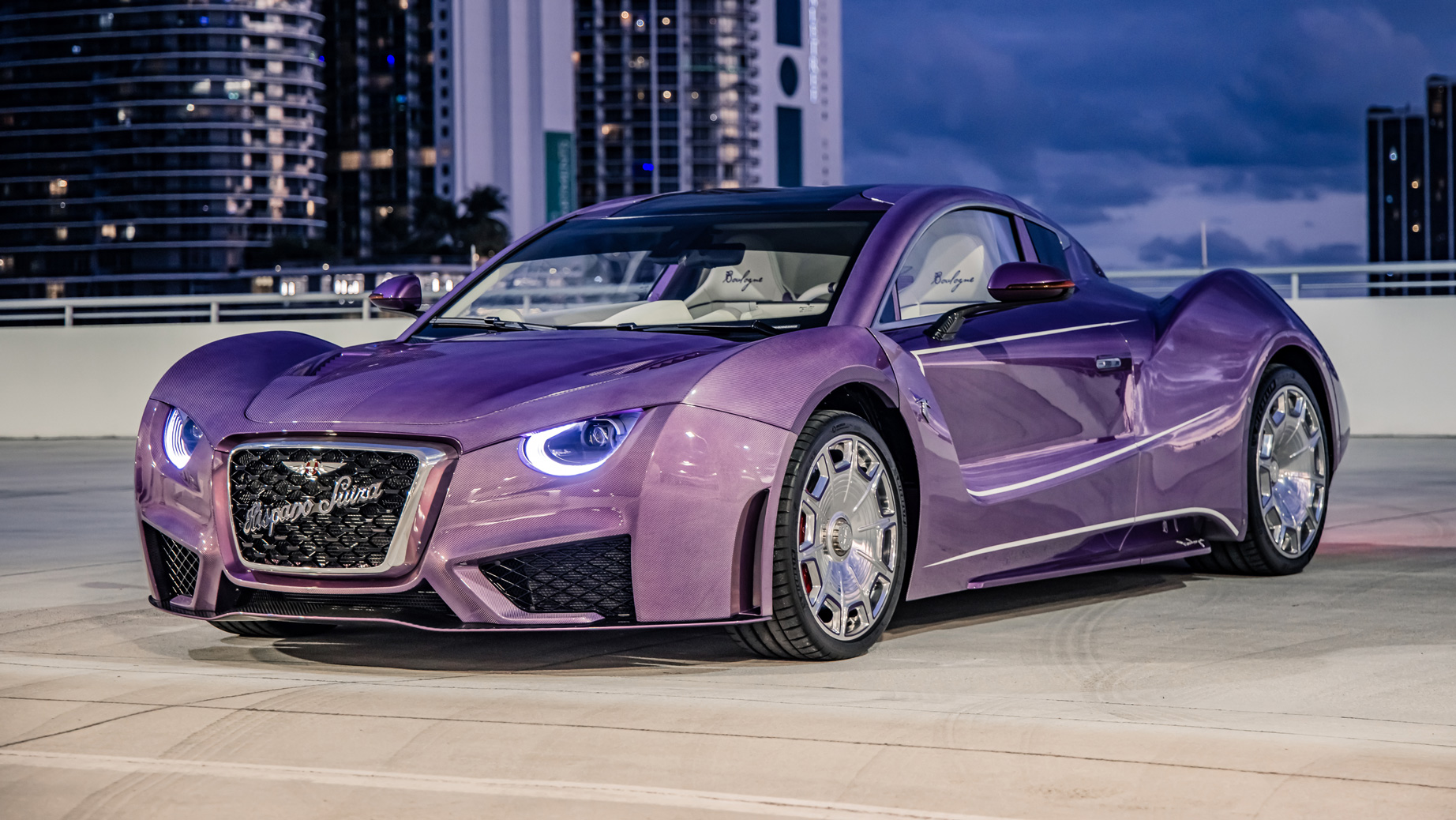Front-angled shot of a purple Hispano Suiza Carmen Boulogne electric car.
