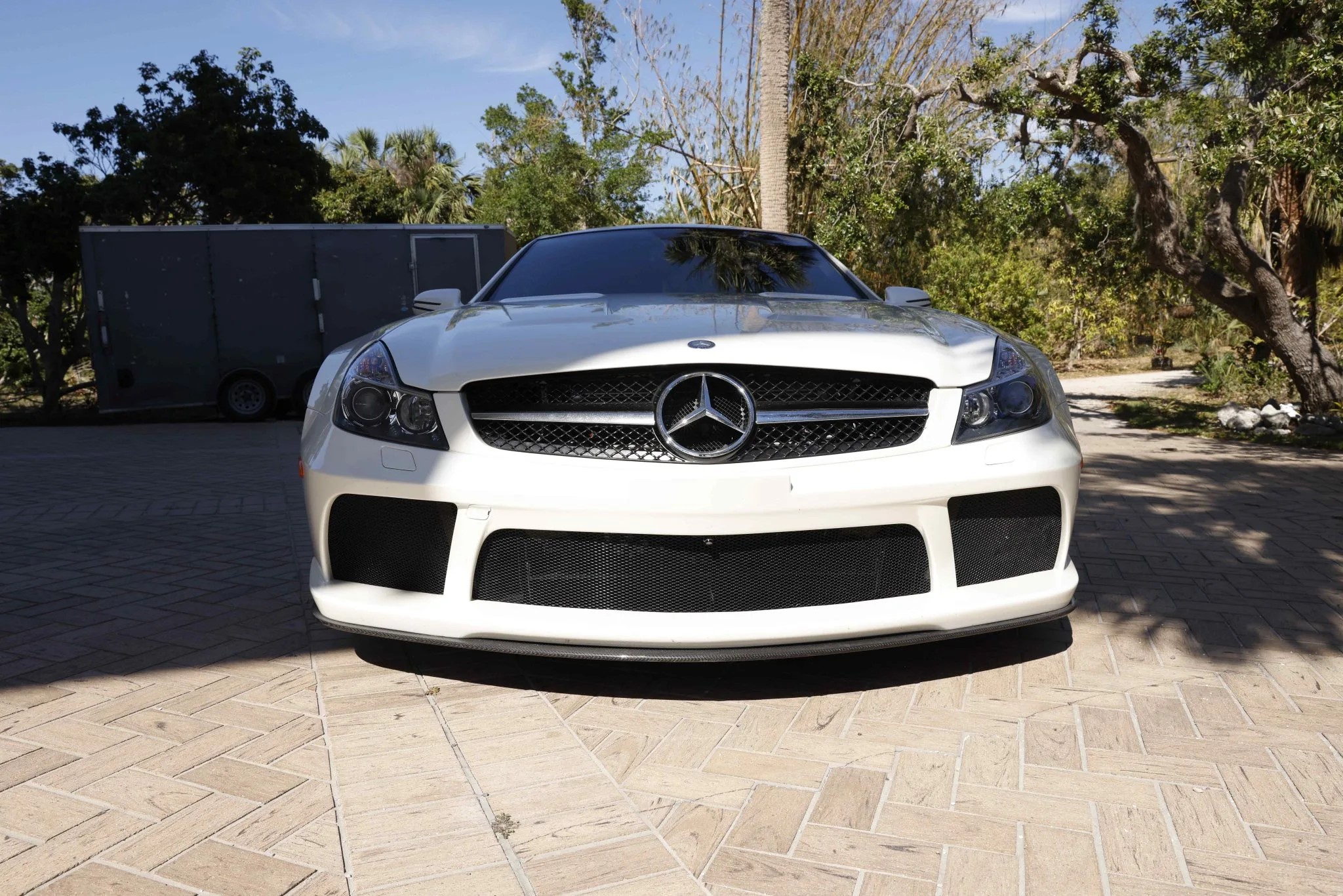 frontal view of a white 2009 mercedes benz sl65 amg black series