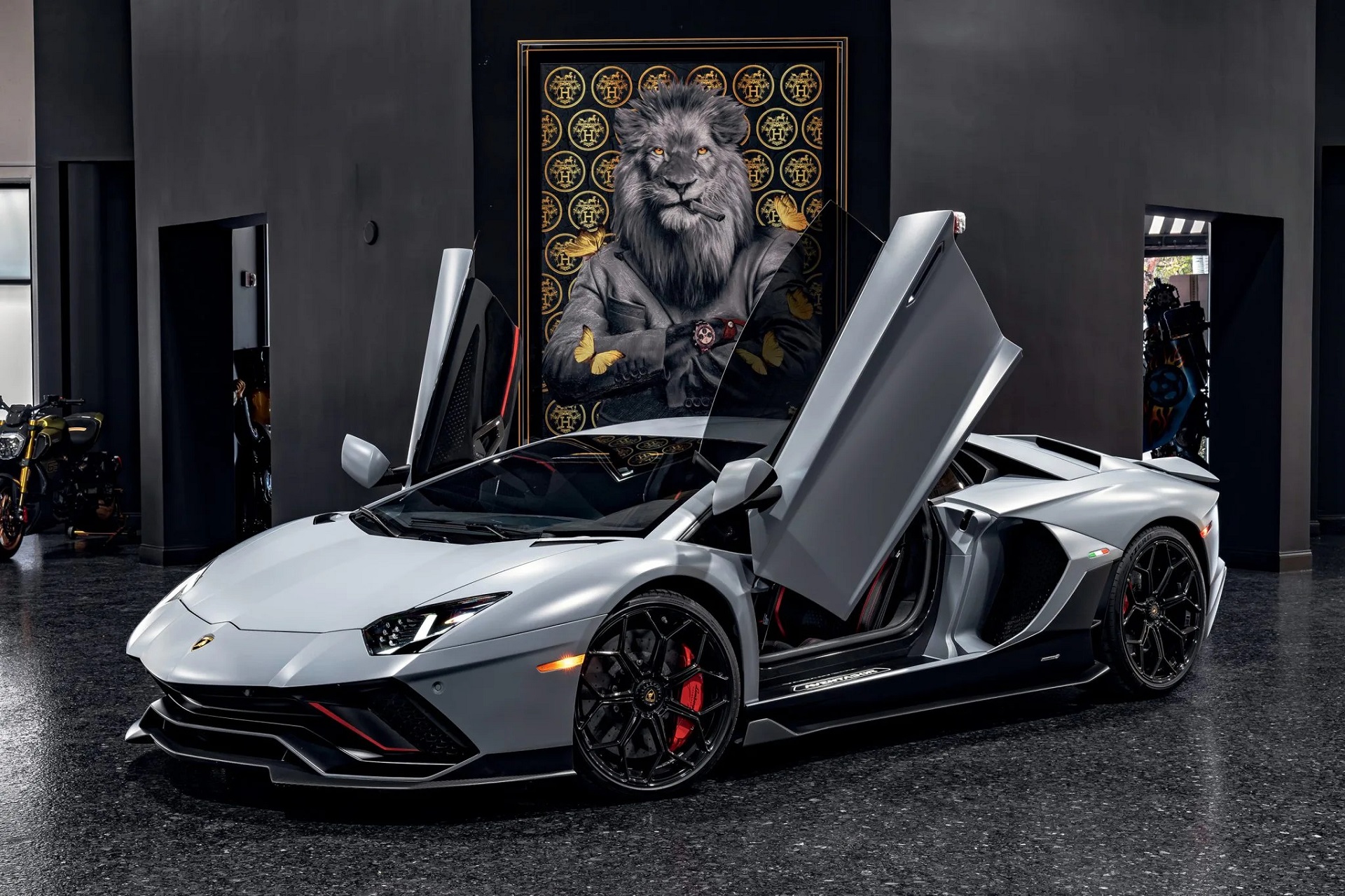 Image of a grey 2022 Lamborghini Aventador LP780-4 Ultimae with the scissor doors open.