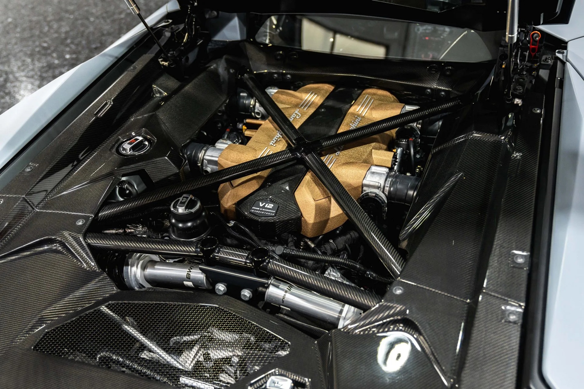 Engine bay of a grey 2022 Lamborghini Aventador LP780-4 Ultimae