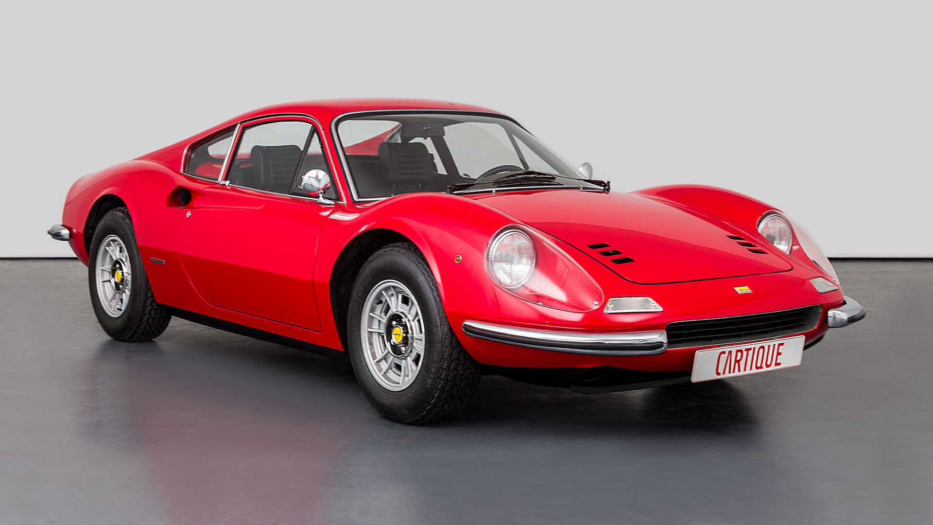 Front-angled view of a red Ferrari Dino 246 GT