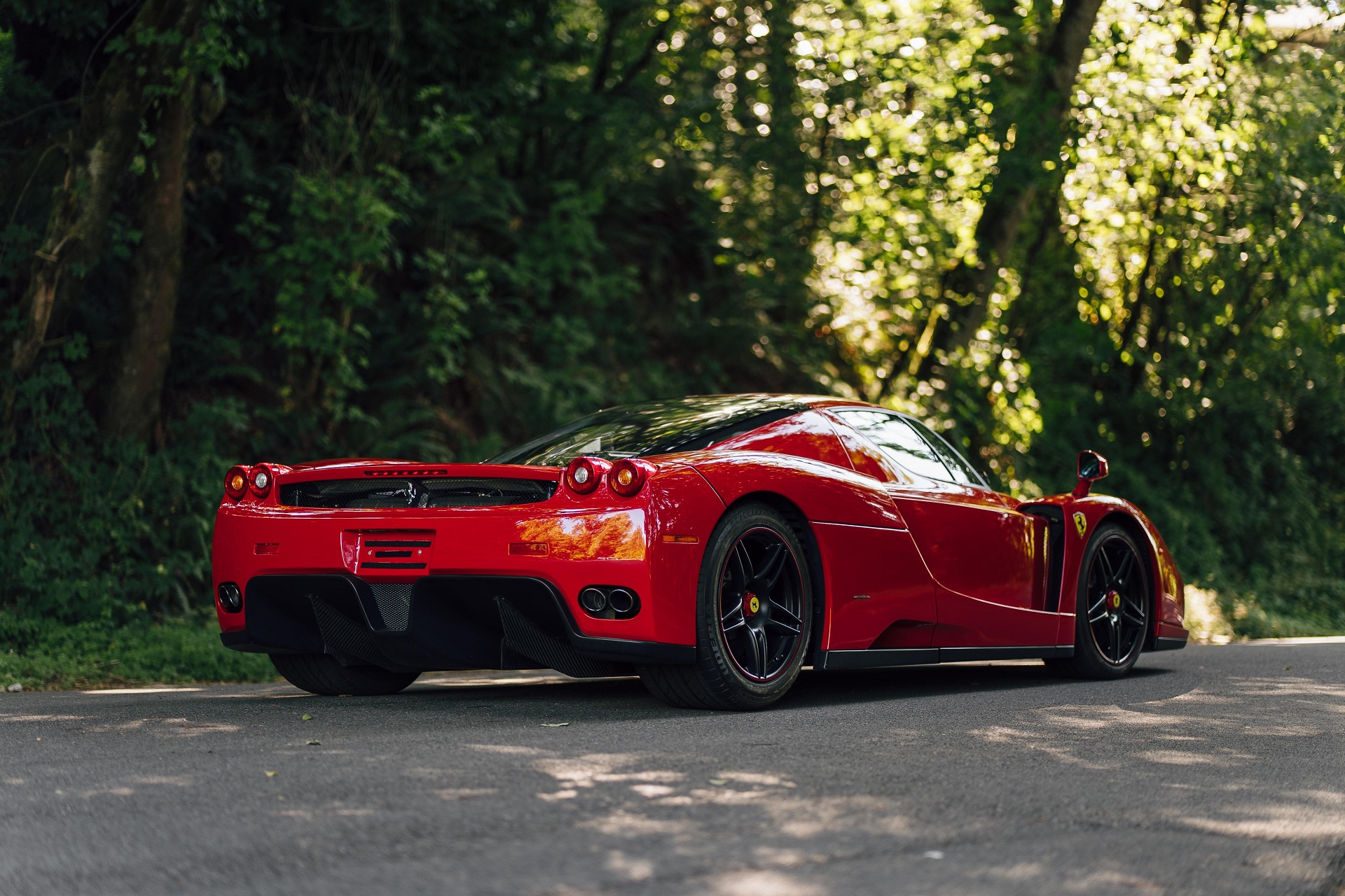 rear-angled view of the red 2003 Ferrari Enzo