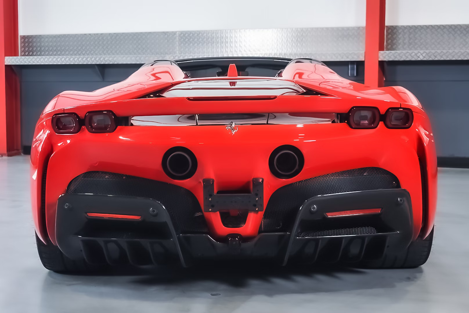 rear-view-of-a-2022-Rosso-Corsa-Ferrari-SF90-Spider