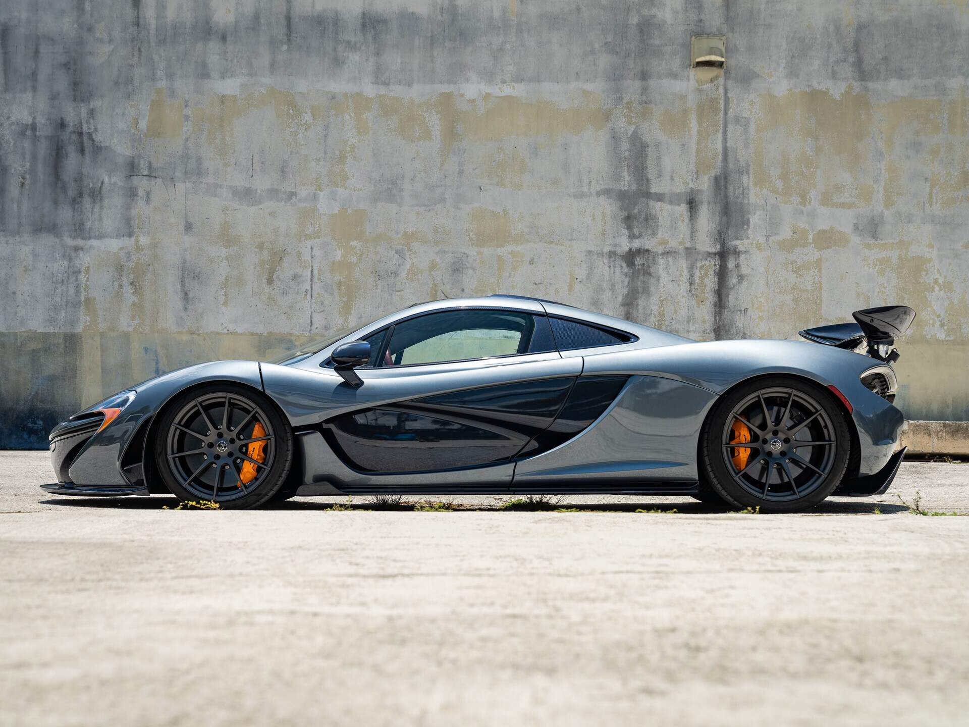 side profile of a grey 2015 McLaren P1