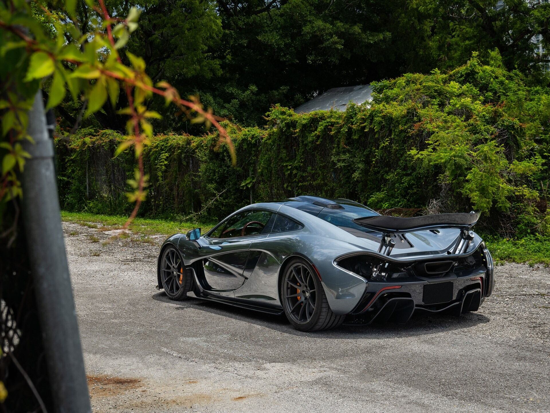 rear angled view of a grey 2015 McLaren P1