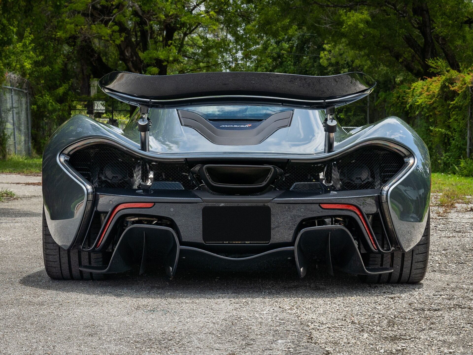 rear profile of a grey 2015 McLaren P1