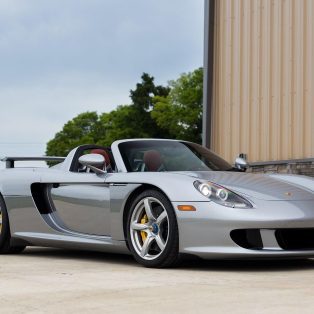 front-angled view of a silver 2005 Porsche Carrera GT.