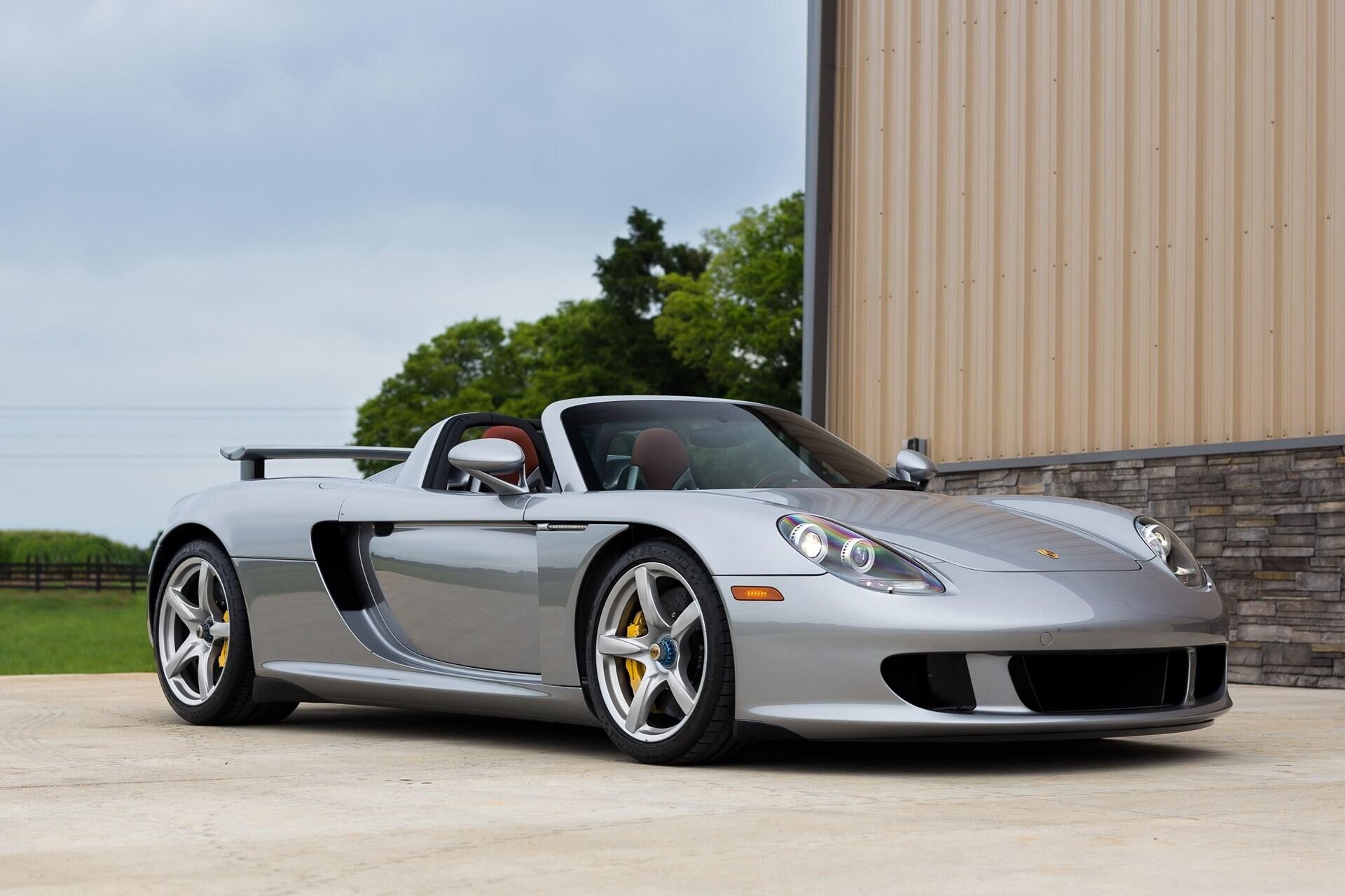 front-angled view of a silver 2005 Porsche Carrera GT.